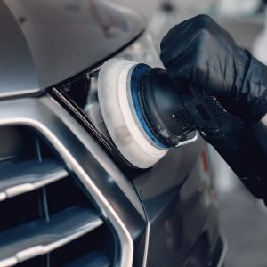 man-polish-car-garage